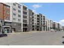 1310-4641 128 Avenue Ne, Calgary, AB  - Outdoor With Balcony With Facade 