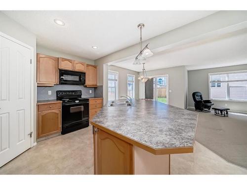 329 Eversyde Circle Sw, Calgary, AB - Indoor Photo Showing Kitchen With Double Sink