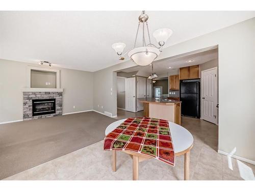 329 Eversyde Circle Sw, Calgary, AB - Indoor With Fireplace
