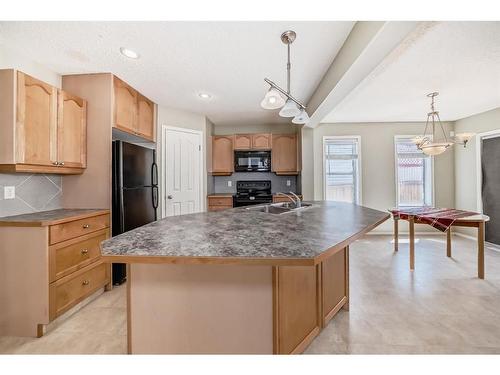 329 Eversyde Circle Sw, Calgary, AB - Indoor Photo Showing Kitchen With Double Sink