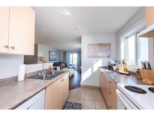 4202-1620 70 Street, Calgary, AB - Indoor Photo Showing Kitchen With Double Sink