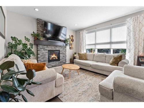 165 Ranch Road, Okotoks, AB - Indoor Photo Showing Living Room With Fireplace
