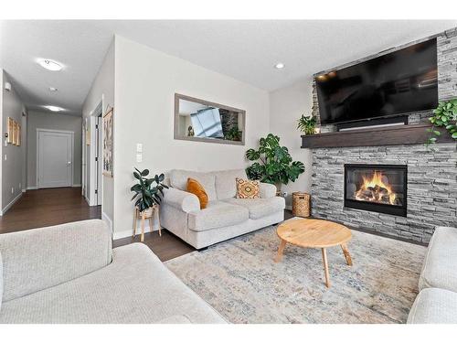 165 Ranch Road, Okotoks, AB - Indoor Photo Showing Living Room With Fireplace