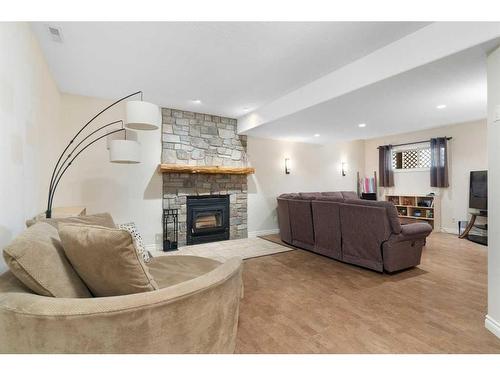 147-5417 Highway 579, Rural Mountain View County, AB - Indoor Photo Showing Living Room With Fireplace