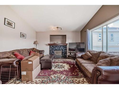 231 Prestwick Landing Se, Calgary, AB - Indoor Photo Showing Living Room With Fireplace