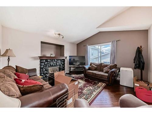 231 Prestwick Landing Se, Calgary, AB - Indoor Photo Showing Living Room With Fireplace