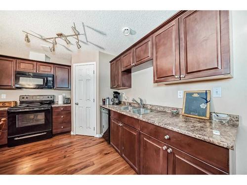 231 Prestwick Landing Se, Calgary, AB - Indoor Photo Showing Kitchen With Double Sink
