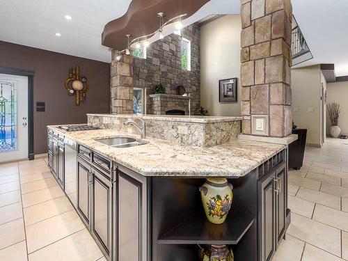 1628 25 Avenue, Didsbury, AB - Indoor Photo Showing Kitchen With Double Sink