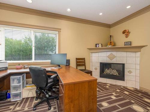 1628 25 Avenue, Didsbury, AB - Indoor Photo Showing Office With Fireplace