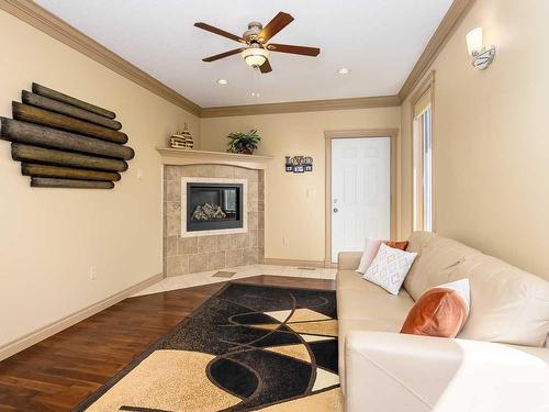 1628 25 Avenue, Didsbury, AB - Indoor Photo Showing Living Room With Fireplace