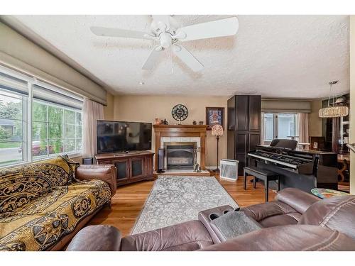8016 7 Street Sw, Calgary, AB - Indoor Photo Showing Living Room With Fireplace