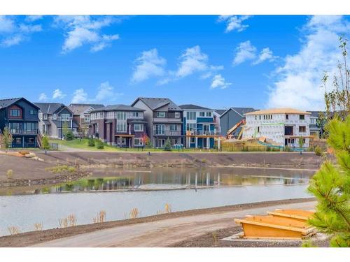 311 Mallard Crossing Se, Calgary, AB - Outdoor With Body Of Water