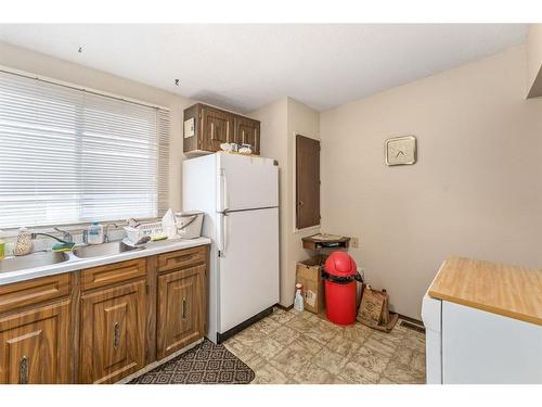 1014 & 1014A 19 Avenue Nw, Calgary, AB - Indoor Photo Showing Kitchen With Double Sink