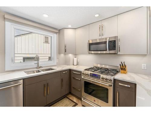 1014 & 1014A 19 Avenue Nw, Calgary, AB - Indoor Photo Showing Kitchen With Double Sink With Upgraded Kitchen