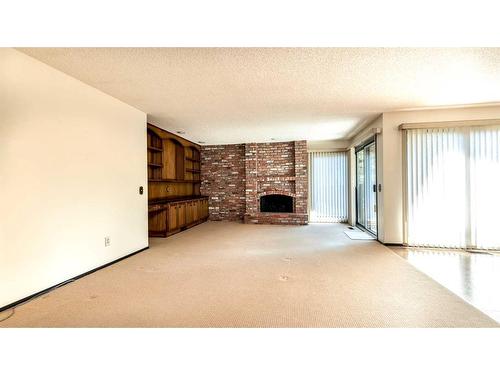 66 Willow Park Green Se, Calgary, AB - Indoor With Fireplace