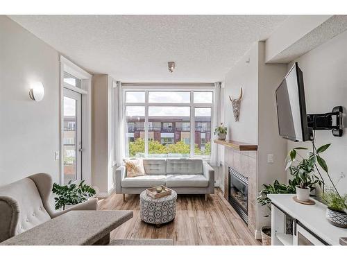 420-990 Centre Avenue Ne, Calgary, AB - Indoor Photo Showing Living Room With Fireplace