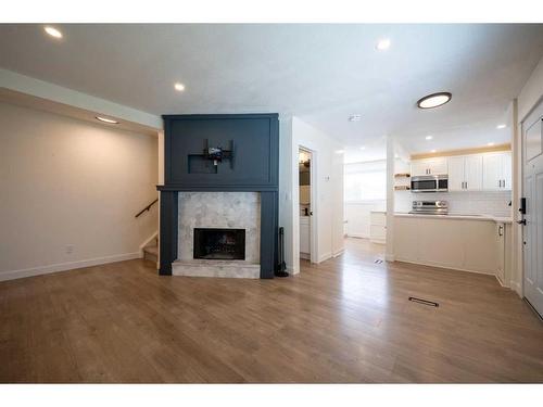 63-740 Bracewood Drive Sw, Calgary, AB - Indoor Photo Showing Living Room With Fireplace