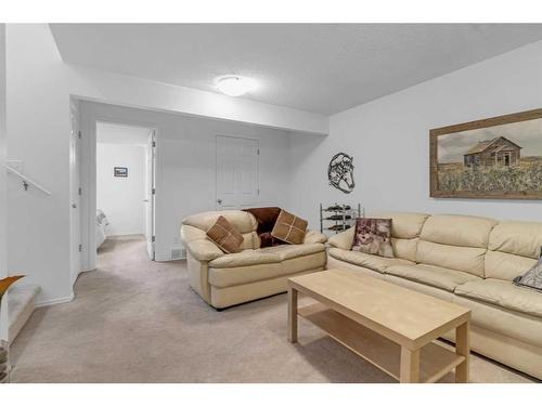 169 Eversyde Boulevard Sw, Calgary, AB - Indoor Photo Showing Living Room