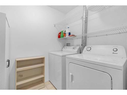 169 Eversyde Boulevard Sw, Calgary, AB - Indoor Photo Showing Laundry Room