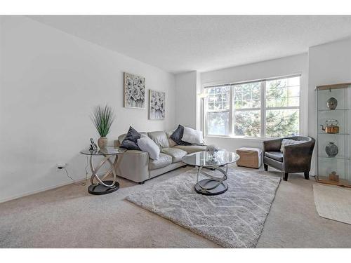 169 Eversyde Boulevard Sw, Calgary, AB - Indoor Photo Showing Living Room