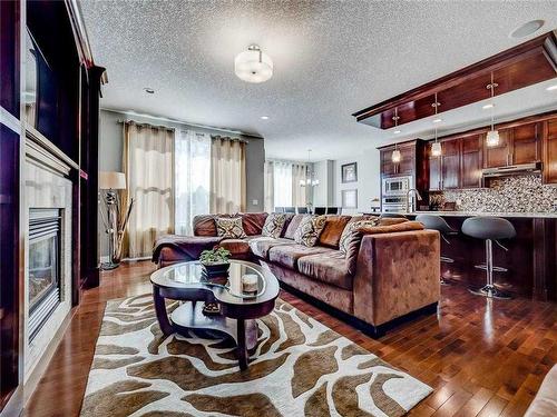 20 Sage Meadows Circle Nw, Calgary, AB - Indoor Photo Showing Living Room With Fireplace