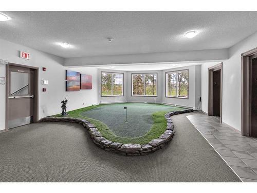 208-1 Crystal Green, Okotoks, AB - Indoor Photo Showing Dining Room