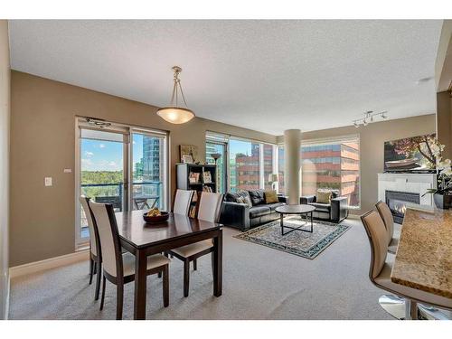 1004-910 5 Avenue Sw, Calgary, AB - Indoor With Fireplace