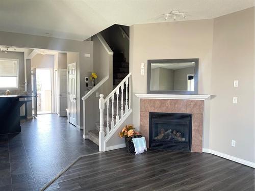 20 Covehaven Crescent Ne, Calgary, AB - Indoor Photo Showing Living Room With Fireplace