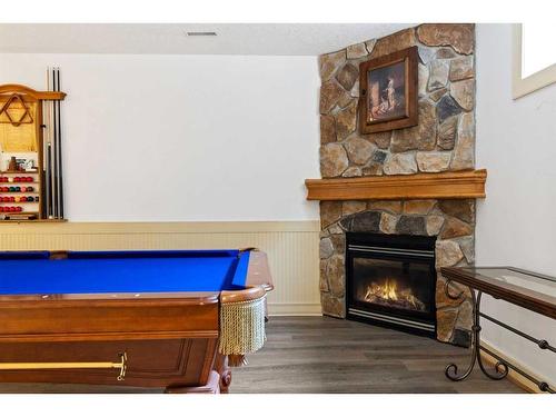 393 Banister Drive, Okotoks, AB - Indoor Photo Showing Living Room With Fireplace