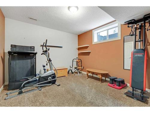 393 Banister Drive, Okotoks, AB - Indoor Photo Showing Gym Room