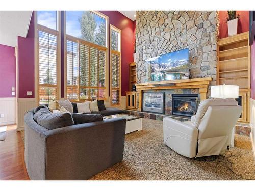 393 Banister Drive, Okotoks, AB - Indoor Photo Showing Living Room With Fireplace