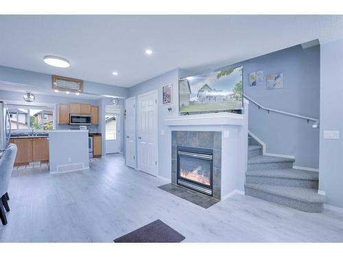 347 Elgin View Se, Calgary, AB - Indoor Photo Showing Living Room With Fireplace