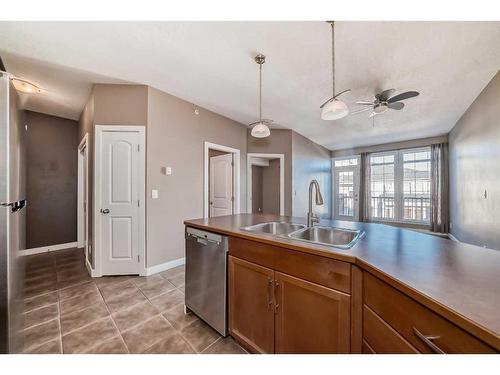 314-15304 Bannister Road Se, Calgary, AB - Indoor Photo Showing Kitchen With Double Sink