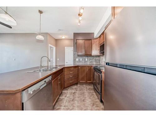 314-15304 Bannister Road Se, Calgary, AB - Indoor Photo Showing Kitchen With Double Sink