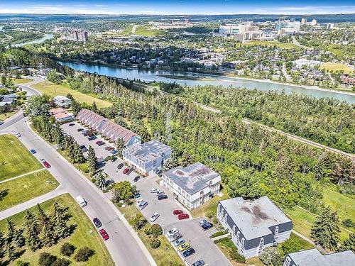 102-320 Cedar Crescent Sw, Calgary, AB - Outdoor With Body Of Water With View