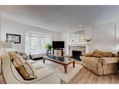 243 Flett Drive Ne, Airdrie, AB - Indoor Photo Showing Living Room With Fireplace