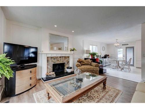 243 Flett Drive Ne, Airdrie, AB - Indoor Photo Showing Living Room With Fireplace