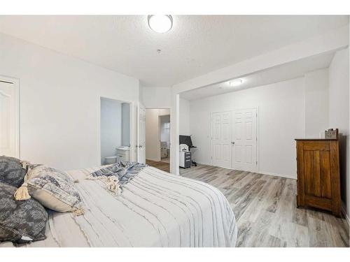 103-15212 Bannister Road Se, Calgary, AB - Indoor Photo Showing Bedroom