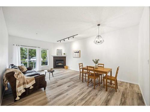 103-15212 Bannister Road Se, Calgary, AB - Indoor With Fireplace