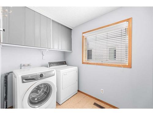 307 Schubert Place Nw, Calgary, AB - Indoor Photo Showing Laundry Room