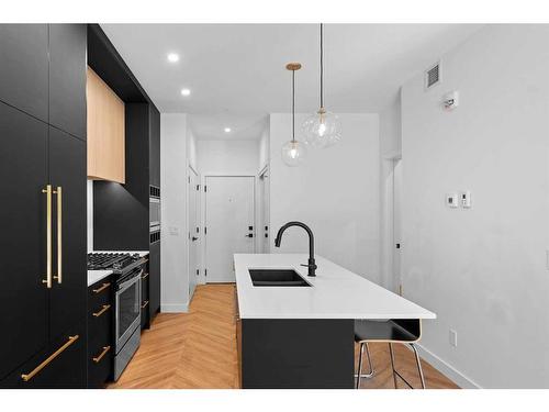 122-4275 Norford Avenue Nw, Calgary, AB - Indoor Photo Showing Kitchen With Double Sink With Upgraded Kitchen