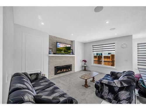 4516 84 Avenue Ne, Calgary, AB - Indoor Photo Showing Living Room With Fireplace