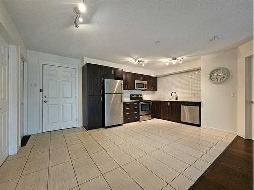 1305-279 Copperpond Common Se, Calgary, AB - Indoor Photo Showing Kitchen With Stainless Steel Kitchen