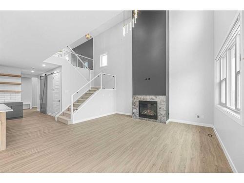 320 Muirfield Crescent, Lyalta, AB - Indoor Photo Showing Living Room With Fireplace