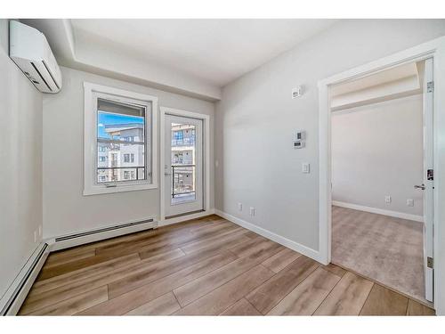 308-125 Wolf Hollow Crescent Se, Calgary, AB - Indoor Photo Showing Kitchen With Upgraded Kitchen