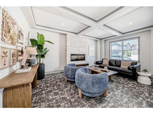 308-125 Wolf Willow Crescent Se, Calgary, AB - Indoor Photo Showing Living Room With Fireplace