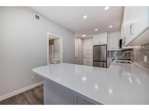 308-125 Wolf Hollow Crescent Se, Calgary, AB - Indoor Photo Showing Kitchen With Stainless Steel Kitchen With Upgraded Kitchen