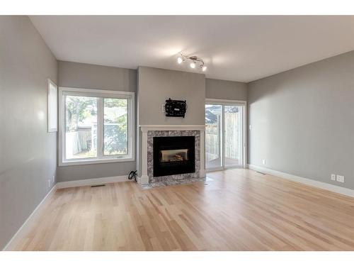 1720 Broadview Road Nw, Calgary, AB - Indoor Photo Showing Living Room With Fireplace