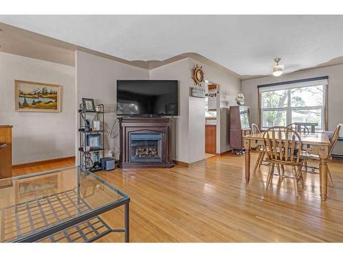 1 Trafford Crescent Nw, Calgary, AB - Indoor With Fireplace