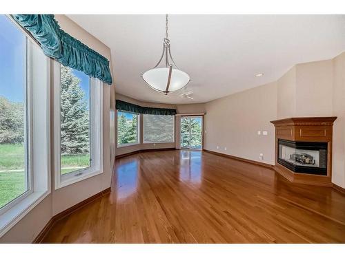 53 Hampstead Green Nw, Calgary, AB - Indoor Photo Showing Other Room With Fireplace